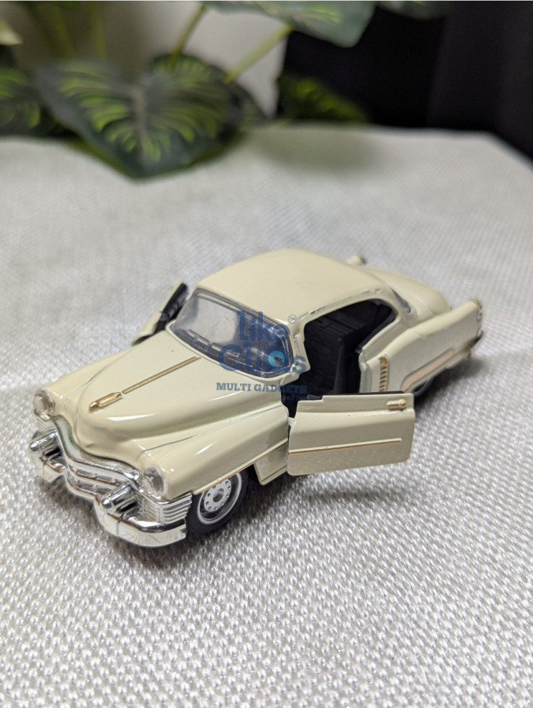 Step back in time with this 1:32 scale vintage Cadillac metal miniature
