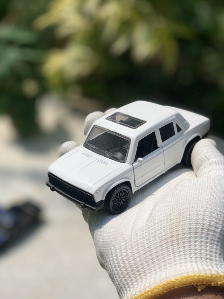 Add a touch of vintage charm with this 1:32 Scale Lada metal miniature